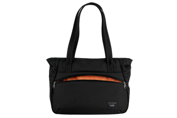 Photo of the Nomad Tote in Black Ballistic with Zest (orange with white grid) 200 Halcyon interior.